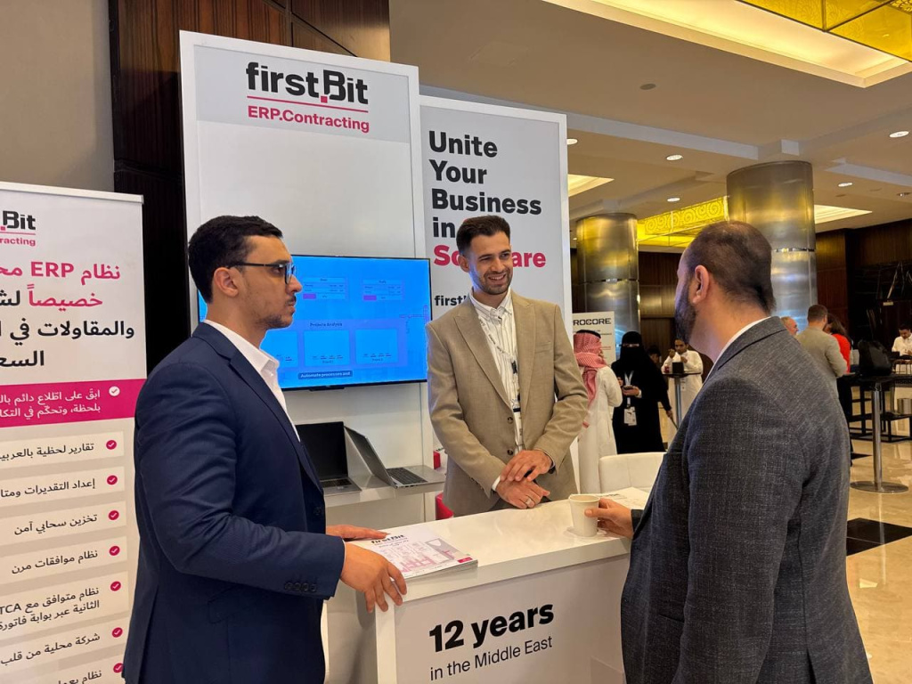 Sofiane Djerad and Mokhamad Khadri meeting clients at the FirstBit stand